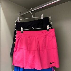 Hot pink tennis skirt with built-in shorts.